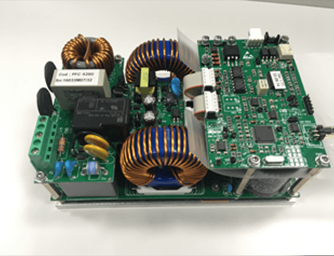 Close-up of electronic components and inductors in a professional custom power supply